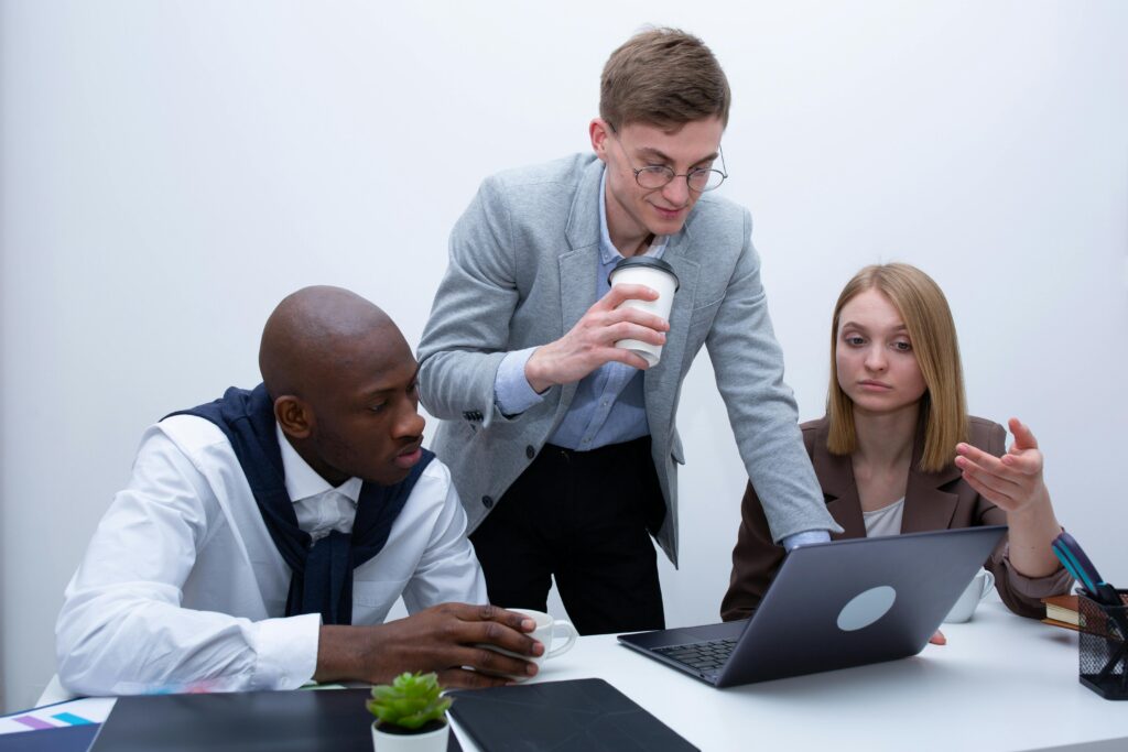 Three people having a discussion.